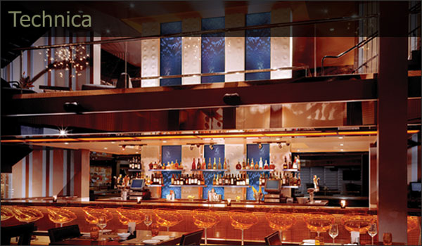 Custom Orange Dimension adds energy to a sleek bar.